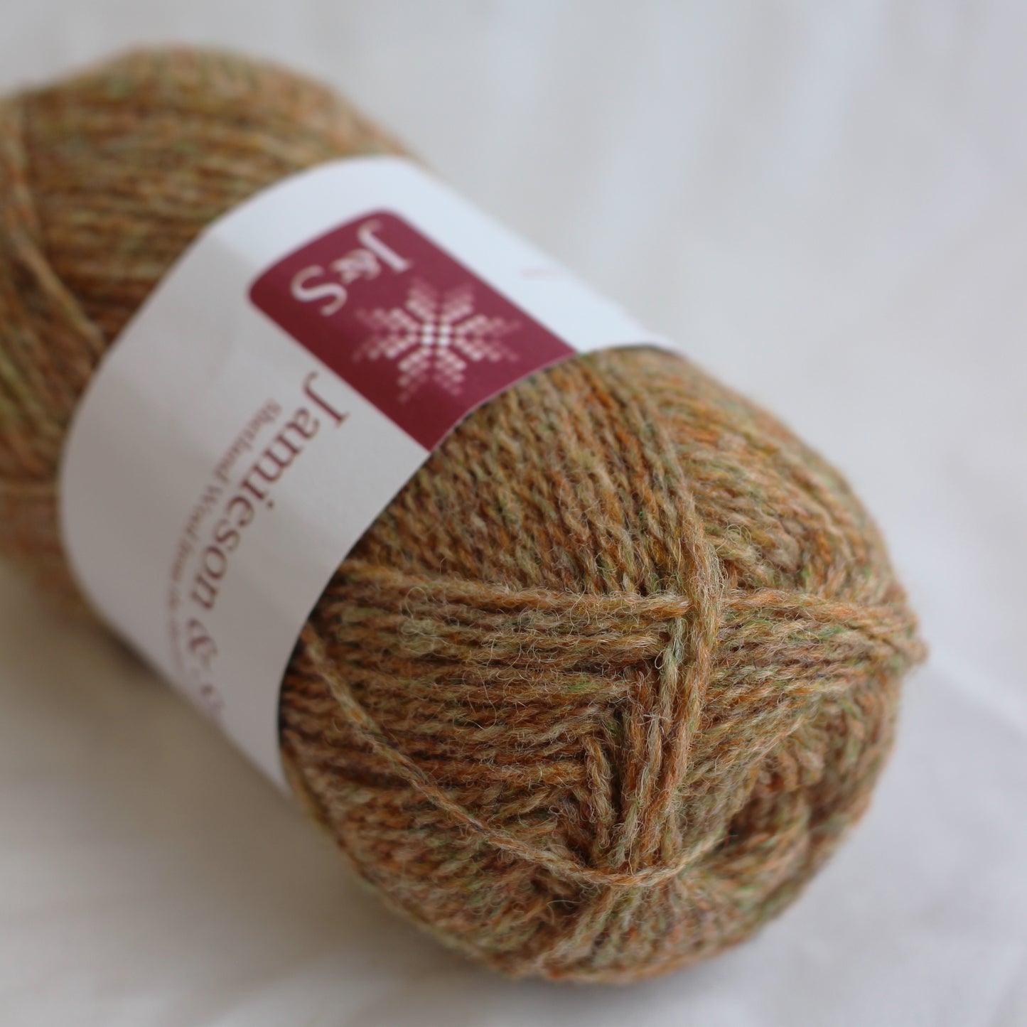 Ball of yarn with a label on a white background