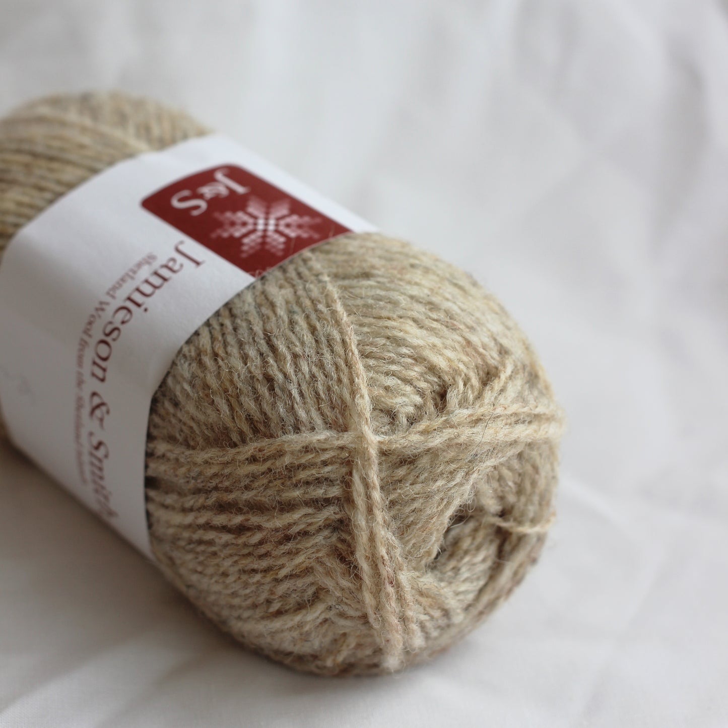 Ball of yarn with a label on a white background