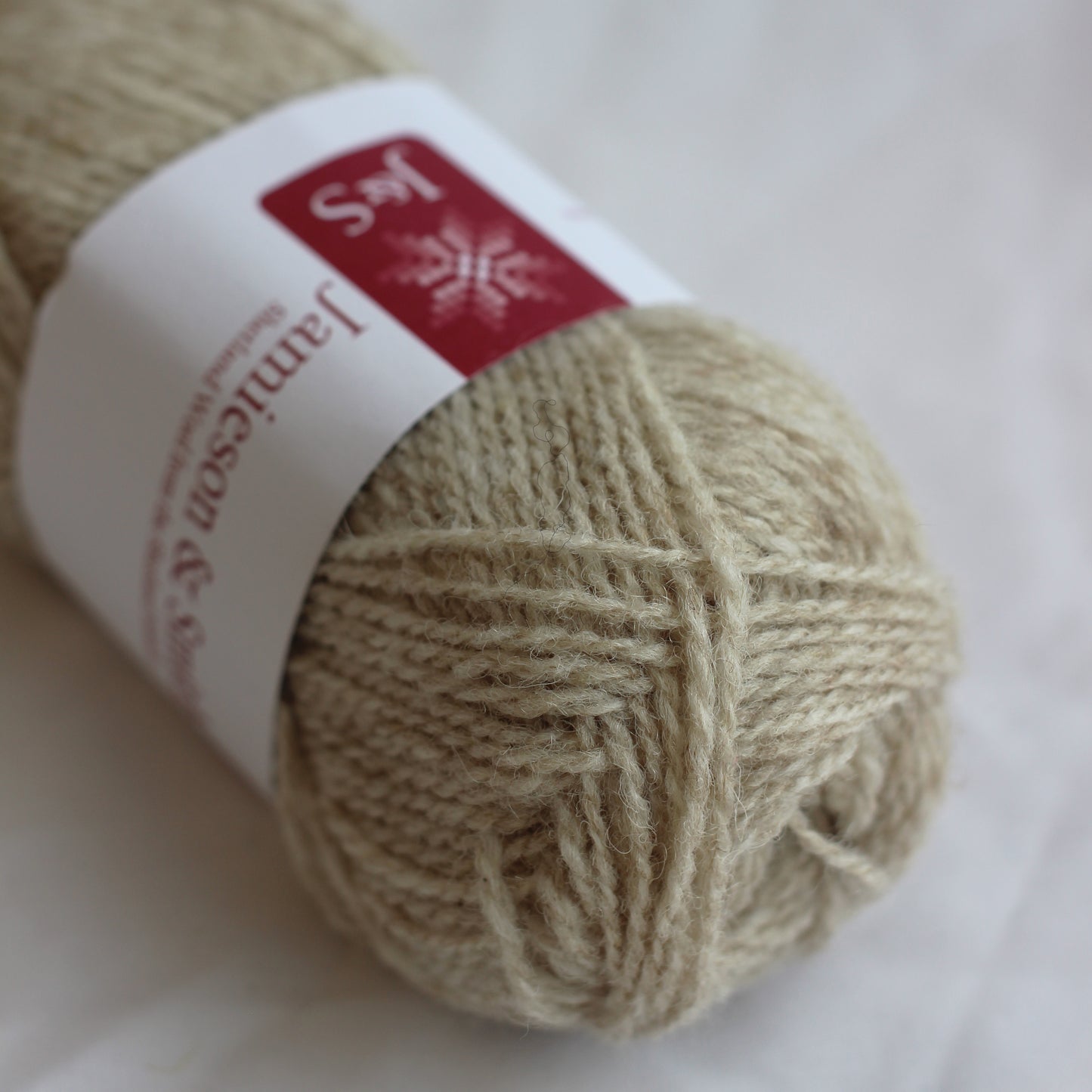 Ball of yarn with a label on a white background