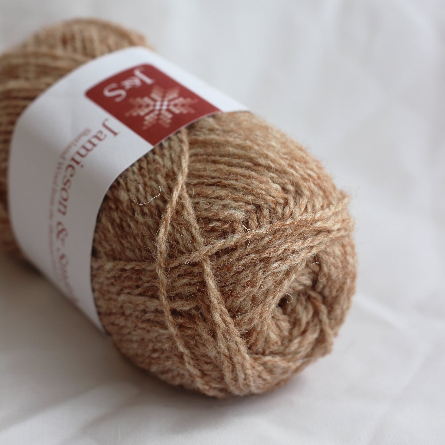 Ball of yarn with a label on a white background