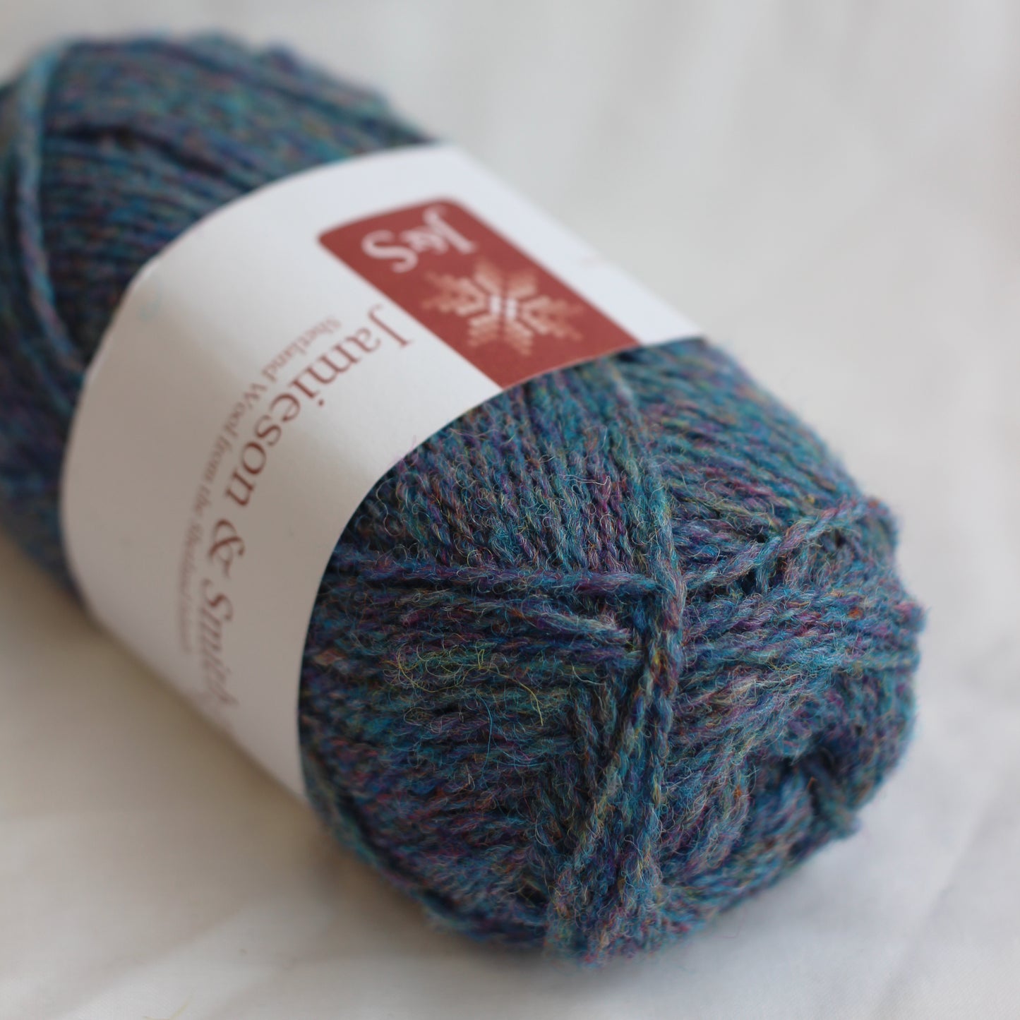 Ball of yarn with a label on a white background