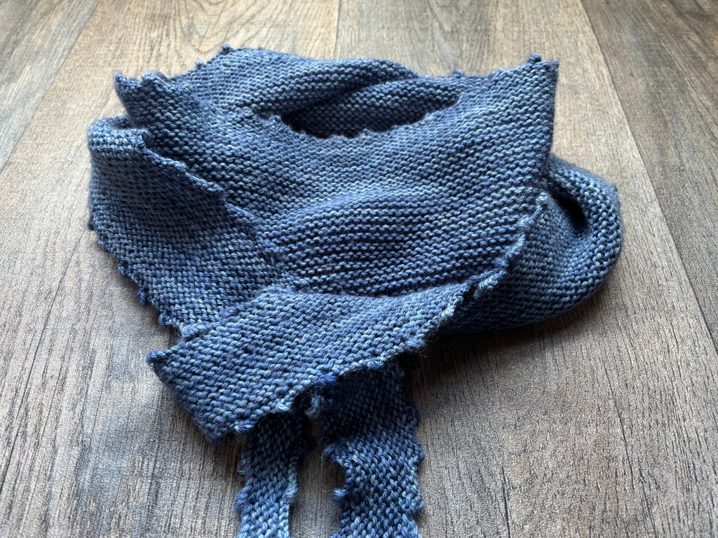 Single Skein Wrap - Pattern featuring a picot edged design, showcasing a delicate knit wrap on a wooden background.