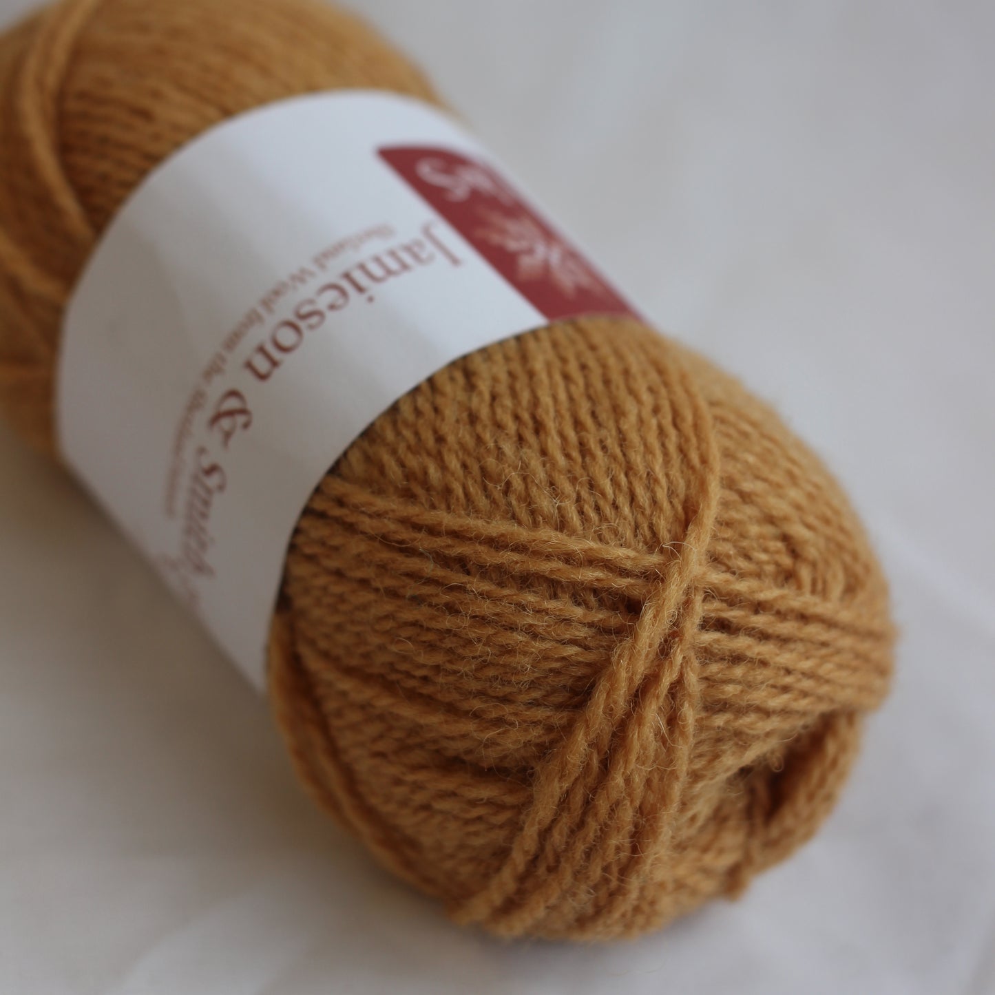 Ball of yarn with a label on a white background